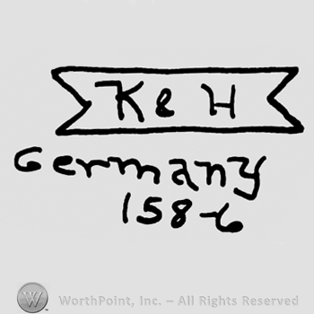 Uppercase K&H on a label over Germany written with lowercase letters, numbers 158-6 written below