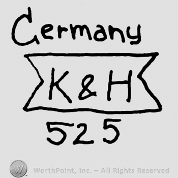 Germany written with lowercase letters over uppercase K&H on a ribbon, number 525 written below