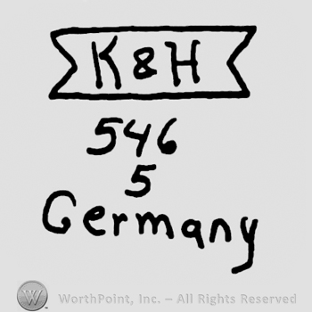 Uppercase K&H on a ribbon over number 546and 5, and Germany written with lowercase letters