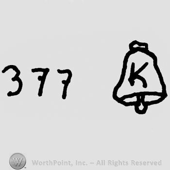 Uppercase K on a bell precedeed by number 377