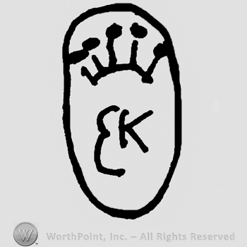 Stylized crown over uppercase EK inside an oval