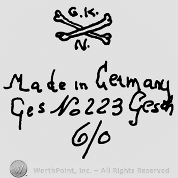 Crossed bones, uppercase G.K.N., Made in Germany Ges. No. 223 Gesch. Written with lowercase letters over number 6/0