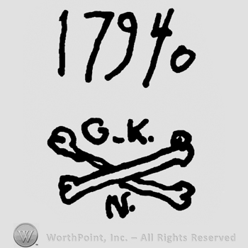 Number 17940 over uppercase G.K.over crossed bones, uppercase N below