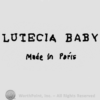 Lutecia Baby written with uppercase letters over Made in Paris written with lowercase letters