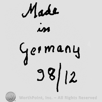Made in Germany handwritten with lowercase letters over number 98/12