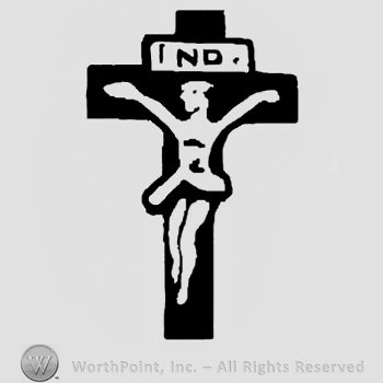 Crucifix and letters ND above.