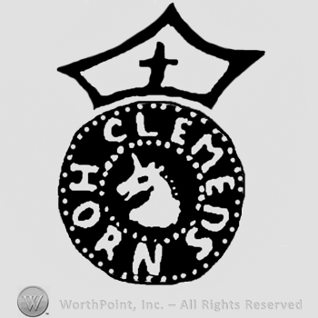 Crowned round design with unicorn in the middle and CLEMENS HORN written on the edge.