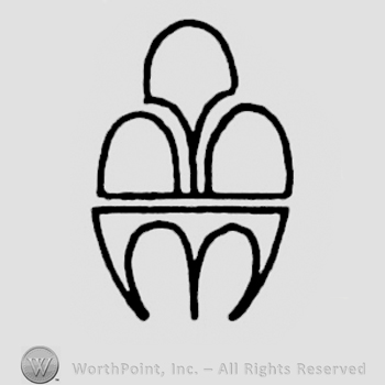 Oval shaped design, three-tooth design on the lower half.
