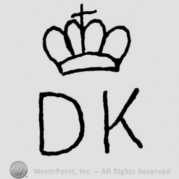A crown with a small cross on top;letters D K written under.