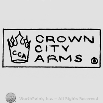 A rectangle with a crown and words CROWN CITY ARMS inside of it;CCA written in the crown.