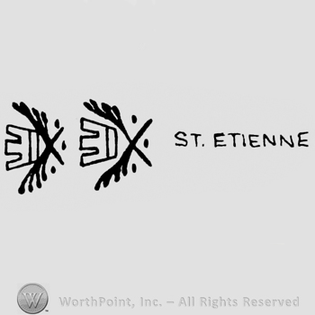 Two crossed branches and a crown between; ST ETIENNE written on the right.