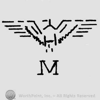Eagle shape with opened wings;letter M written bellow.