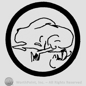 Circle with a rabbit inside sitting in grass.