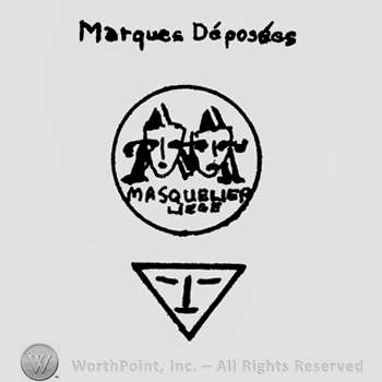 Circle enclosing two faces and a triangle bellow; MARQUES DEPOSEES written above.
