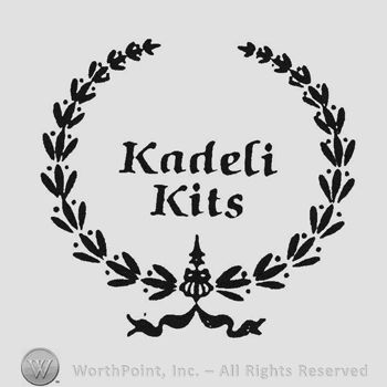 Writing Kadeli between laurels