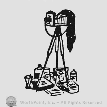 Vintage camera with photography related objects beneath