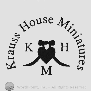 Writing Krauss House Miniatures in semi-circle above heart and initials KHM left right and under