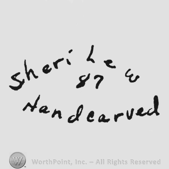 Curved writing Sheri Lew up Handcarved under 87 middle