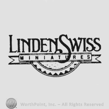 Bold writing Linden Swiss above ribbon writing Miniatures and half gear under