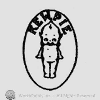Baby doll in the centre of an oval. Kewpie written above, inside the oval