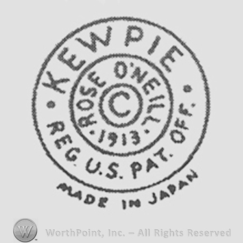 Rose O'Neill 1913 curved written around a circle inside which is letter C. Around the second circle are written: Kewpie, Reg. U.S. Pat. Off.