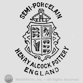 Semi-Porcelain curved written above, stylish crown above shield containing four squares with different images: a lion on two legs, three running lions, a harp. Henry Alcock Pottery, Cobridge, England curved written below on three lines