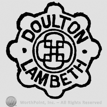 Wheel with writings inside: written: Doulton above, Burslem below, image of a cross in the centre