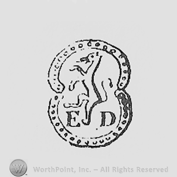 Circle enclosing a lion and initials G and J.