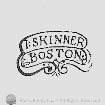 I SKINNER BOSTON written on a flower shape.