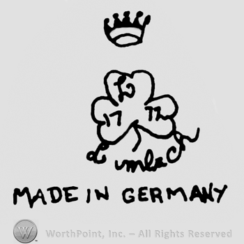 Crown over a three-leaf clover, uppercase handwritten L and numbers 17 and 72 written on it's leaves, Lumbach handwritten below, Made in Germany written with uppercase letters