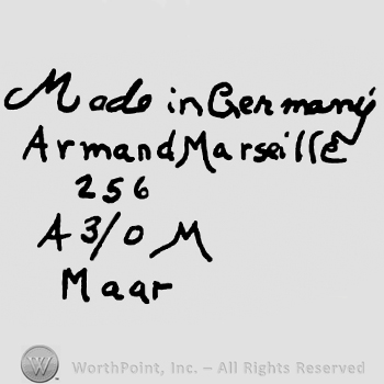 Made in Germany handwritten over Armand Marseille 256 written with lowercase letters, uppercase A, number 3/0 and uppercase M over Maar written with lowercase letters