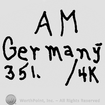 Uppercase AM over Germany written with lowercase letters and numbers 351/4 and uppercase K