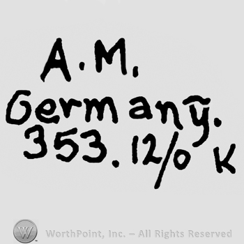 Uppercase A.M.over Germany written with lowercase letters and numbers 353.12/0 and uppercase K