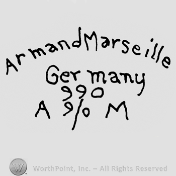 Armand Marseille Germany written with lowercase letters over number 590 and uppercase A and M framing numbers 9/0