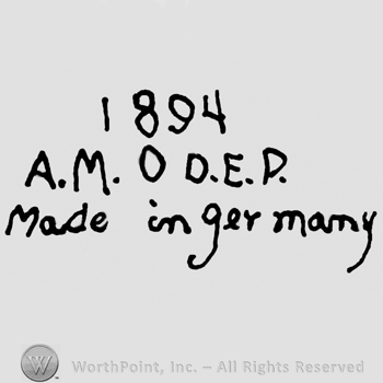 Number 1894 over uppercase A.M., zero, uppercase D.E.P., Made in Germany written below with lowercase letters