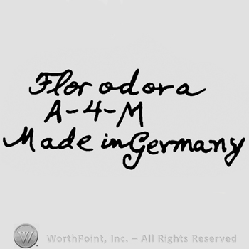 Florodora handwritten with lowercase letters over uppercase A, number 4 and uppercase M, Made in Germany handwritten below with lowercase letters
