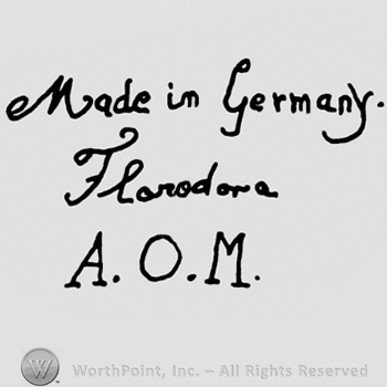 Made in Germany Florodora handwritten with lowercase letters over uppercase AOM