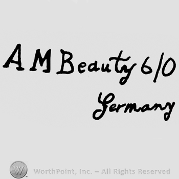 Uppercase AM followed by Beauty 6/0 written with lowercase letters, Germany written below with lowercase letters