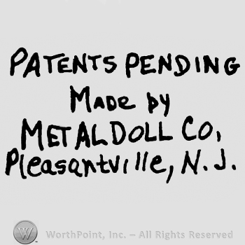 Patents Pending Made by Metal Doll Co, Pleasantville, N.J.written with uppercase letters except Pleasantville which is written with lowercase letters