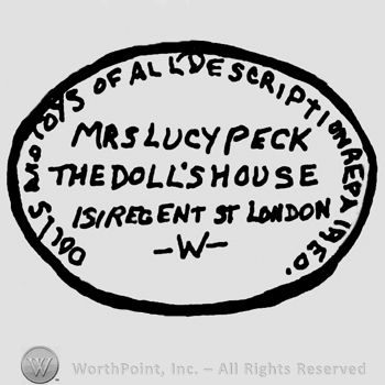 Oval design, Dolls and Toys of All Description Repaired, Mrs. Lucy Peck The Doll's House 131 Regent St. London written with uppercase letters inside