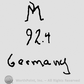 Uppercase M over number 924, Germany written below with lowercase letters