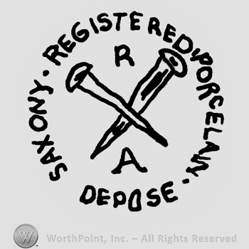 Saxony Registered Porcelain Depose written with uppercase letters around two crossed pins, uppercase R written above and uppercase A written below