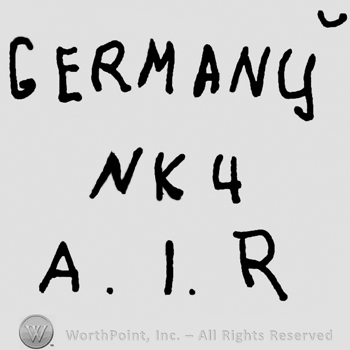 Germany written with uppercase letters over uppercase NK and number 4, uppercase A, I and R