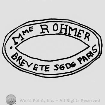 Mme. Rohmer Brevete SGDG Paris written with uppercase letters inside an oval design