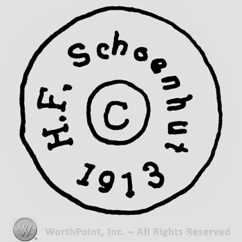 H.F. Schoenhut 1913 written around uppercase C in a circle, all inside a larger circle