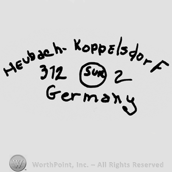 Heubach-Koppelsdorf written with lowercase letters over number 312, uppercase SUR inside a circle, number 2, Germany written below with lowercase letters