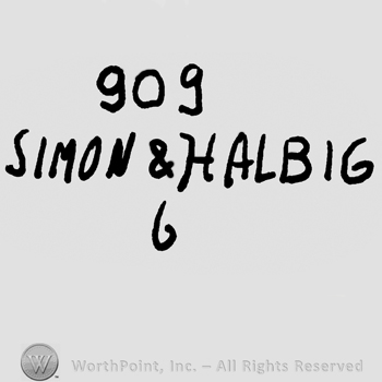 Number 909 over Simon & Halbig written with uppercase letters and number 6