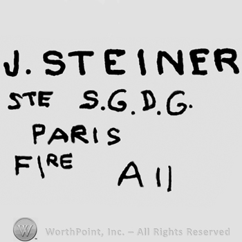 J. Steiner written with uppercase letters over Ste S.G.D.G. Paris Fire A 11, all with uppercase letters