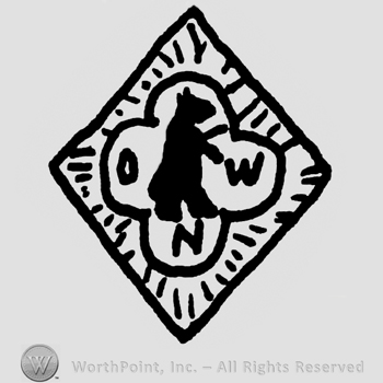Diamond with standing animal on a four-leaf clover, uppercase O, W and N on the petals of the clover