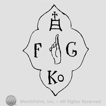 Stylized cross above an image of a hand between letters F and G;  Ko written bellow; all inside a flower shape.